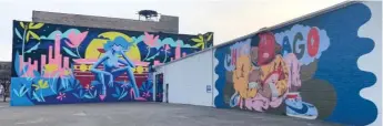  ?? ROBERT HERGUTH/SUN-TIMES ?? Artist Jas Petersen’s mural is located next to Sentrock’s Fulton Market mural.