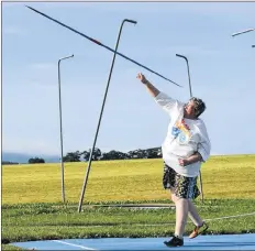  ??  ?? Jane Warren, an independen­t masters (63) level competitor from Wolfville, taking one of four throws during the javelin portion of the Launchers Twilight Throws Meet at the Launch Pad in Port Williams July 23.