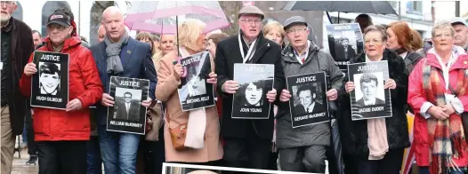  ??  ?? Campaign: Relatives of those who died on Bloody Sunday. Inset: Linda Nash, who lost her brother, is embraced by activist Eamonn McCann