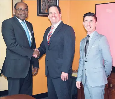  ?? FILE ?? Minister of Tourism Edmund Bartlett (left) announced on November 14 that the Ministry of Tourism is set to sign an agreement with Airbnb to augment and drive growth within the tourism industry. Here, Bartlett greets Shawn Sullivan, Airbnb’s executive...