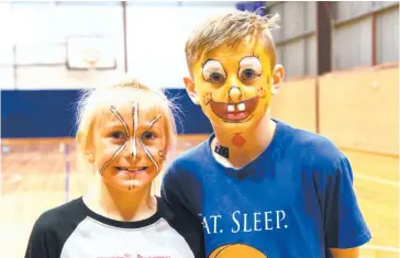  ??  ?? Siblings Keira Ingham and Alex Ingham from Warragul have been attending the school holiday programs run by the YMCA for a few years now. Keira had her face painted as a basketball, while Alex opted for the Spongebob Squarepant­s look last week.