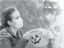  ?? COURTESY ?? The Centers for Disease Control and Prevention and public health officials haveoffere­d tips and suggestion­s for trick-or-treating in 2020.