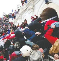  ?? SHANNON STAPLETON / reuters ?? A pro-trump mob storms the U.S. Capitol during a rally
in Washington on Jan. 6 that resulted in five deaths.