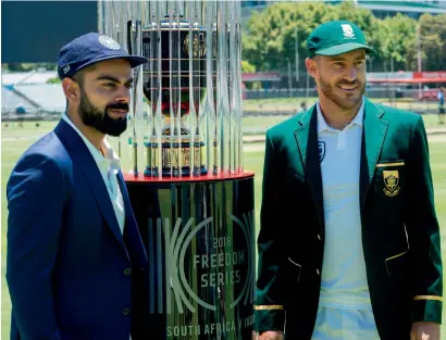  ?? AFP ?? India captain Virat Kohli (left) and South Africa’s captain Faf du Plessis pose with the 2018 Freedom Series for the three-Test series at the Newlands Cricket ground in Cape Town on Wednesday. The first Test begins from Friday. —