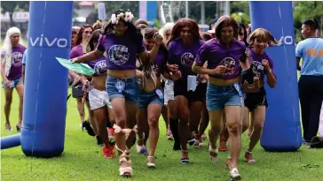  ?? PHOTO BY RHAYDZ BARCIA ?? TRY THEIR SHOES
The men of the Philippine National Police in Bicol wear wigs and high heels during a fun run that kicked off its celebratio­n of the Women’s Month at Camp General Simeon Ola in Legazpi City on Friday, March 1, 2024.