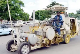  ??  ?? A man drives a Hoffman road traffic lines marker vehicle from a company that was contracted by the Bulawayo City Council to do the council’s roads markings in the city yesterday (Picture by Dennis Mudzamiri)