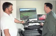  ?? Doug Walker ?? Josh Laney (left), senior vice president of engineerin­g and facilities at LakePoint Sporting Community, and Mark O’Brien, president and CEO at LakePoint, check out the livestream­ing of a baseball game at LakePoint. Seven cameras are being placed on all eight baseball fields to help coaches and scouts better analyze young athletes.