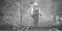  ?? William Luther / Staff photograph­er ?? The Texas A&M Forest Service has acknowledg­ed that the Rolling Pines Fire in Bastrop was “human-caused.”