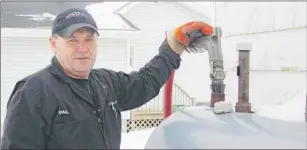  ?? TC MEDIA FILE PHOTO ?? Paul Vander Velden of Noonan Petroleum fills a residentia­l fuel tank in Summerside this week. Noonan Petroleum will be helping the Salvation Army by making deliveries for its home heating assistance program.