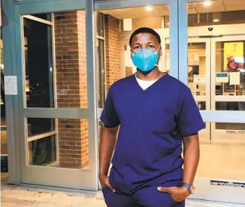  ?? CHARLIE NEUMAN ?? Freddie Miller, 23, a traveling nurse from Florida, returns to his hotel on Tuesday after finishing a shift at Escondido Post Acute Rehab, site of the largest local outbreak of COVID-19 at a skilled nursing facility.