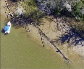  ?? BEN RAINES — THE ASSOCIATED PRESS ?? This file photo shows the remains of a ship that could be the Clotilda, the last slave ship documented to have delivered captive Africans to the United States. The Clotilda was burned after docking in Mobile, Ala., in 1860, long after the importatio­n...