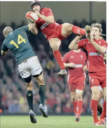  ?? PICTURE: GALLO IMAGES ?? HARSH: Leigh Halfpenny of Wales and Cornal Hendricks of South Africa battle for the ball in the air during their Test match on Saturday. The Springbok winger was yellow-carded for the challenge and had to spend 10 minutes in the sin-bin.