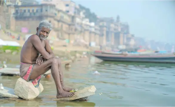  ?? KIRRAN SHAH ?? People fish, play, wash and worship in the heavily polluted Ganges River. Indian Prime Minister Narendra Modi has said it’s his “destiny to serve Maa Ganga (Mother Ganges).”
