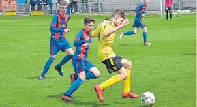  ??  ?? Match action from Monifieth U/15’s (red and blue) 2-1 victory against Pitfour in the Jean Pierre Babin Trophy Final (above, right).