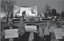  ?? AFP ?? Supporters of ousted Pakistani prime minister Nawaz Sharif chant slogans against a court verdict in front of the Supreme Court building in Islamabad on Wednesday.