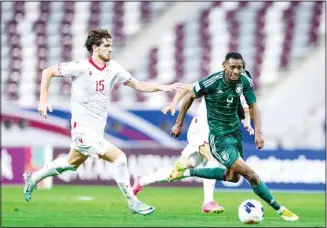  ?? ?? Players challenge for the ball during the Saudi Arabia and Tajikistan match.