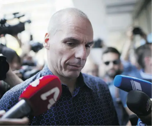  ?? Christophe­r Furlong / Gett y Imag es ?? Former Greek finance minister Yanis Varoufakis is surrounded by reporters as he leaves the finance ministry after resigning on Monday in Athens, Greece, a day after Greek voters rejected new austerity measures in a referendum.