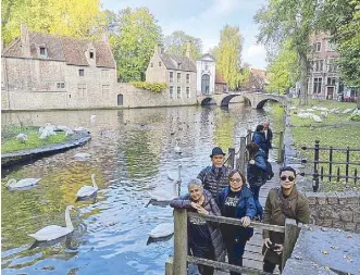  ??  ?? Sandino, Girlie, Nonoy and Celeste in Bruges (the capital of West Flanders in northwest Belgium). Right: Celeste and Nonoy in an impromptu dance number with Filipino folk dancers