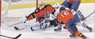  ?? CP PHOTO ?? Toronto Maple Leafs’ Nazem Kadri scores past Florida Panthers goalie Roberto Luongo in the second period of an NHL game Tuesday in Sunrise, Fla.