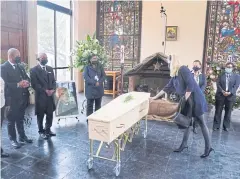  ?? ?? LAST RITES: Princess Mabel of Orange-Nassau touches the coffin of late Archbishop Emeritus Desmond Tutu at his state funeral in Cape Town.