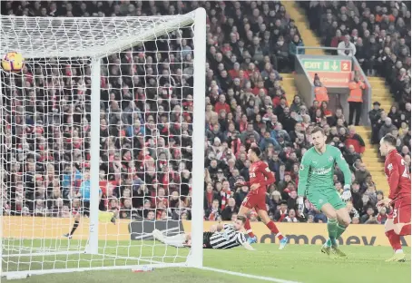  ??  ?? Shaqiri blasts home Liverpool’s third goal in their rout of Newcastle.