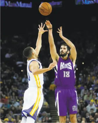  ?? Scott Strazzante / The Chronicle 2015 ?? In eight NBA seasons, 6-foot-9 forward Omri Casspi — shown shooting over the Warriors’ Stephen Curry in 2015 — is a 36.7 percent shooter from three-point range.