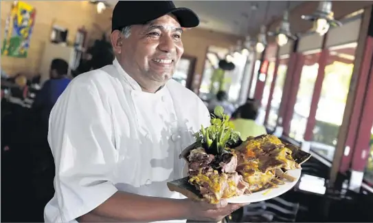  ?? Photog raphs by Irfan Khan Los Angeles Times ?? AQUI ES TEXCOCO in Commerce, a branch of a famous restaurant in Tijuana, specialize­s in lamb barbacoa (roasted lamb), but if they’re out, there are great options.