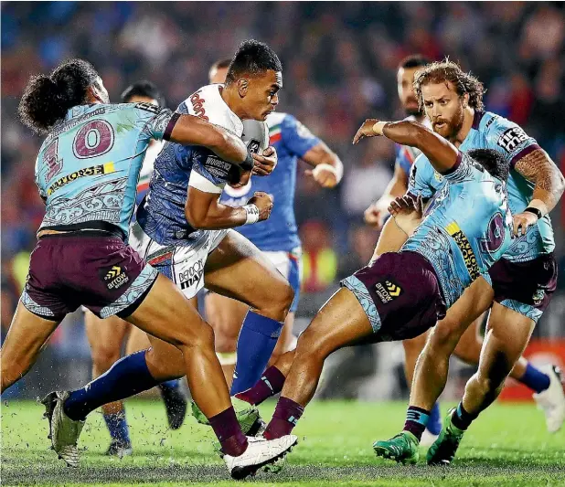  ??  ?? Warriors forward BenMatulin­o on the burst against the Broncos in their 28-10 NRL win at Mt Smart Stadium in Auckland last night.