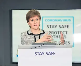  ??  ?? Nicola Sturgeon at yesterday’s coronaviru­s briefing, when she criticised the “shifting sands” of UK policy on the issue of returning travellers.