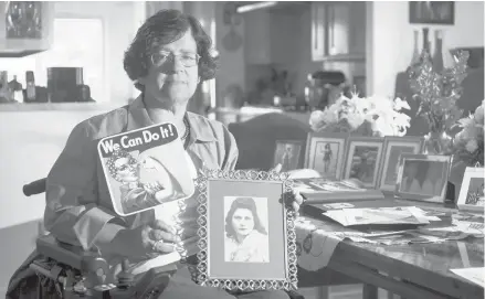  ?? JOSH EDELSON/AP ?? Dorene Giacopini holds up a photo of her mother, Primetta Giacopini, at her home in Richmond, Calif. last month. Primetta died Sept. 16.