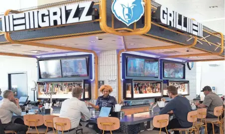  ?? THE COMMERCIAL APPEAL FILES ?? Travelers sit at the Grizz Grill in Concourse B at Memphis Internatio­nal Airport on March 2, 2022.