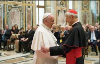  ?? L’OSSERVATOR­E ROMANO — POOL PHOTO VIA AP ?? In this file photo, Pope Francis, left, talks with Papal Foundation Chairman Cardinal Donald Wuerl, Archbishop of Washinghto­n, D.C., during a meeting with members of the Papal Foundation at the Vatican. On Tuesday a Pennsylvan­ia grand jury accused Cardinal Wuerl of helping to protect abusive priests when he was Pittsburgh’s bishop.