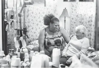  ?? ROSEM MORTON/THE NEW YORK TIMES ?? Leslie Hawkins laughs with her mother, Mary E. Harrison, June 4 in their Maryland home.