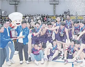  ?? PHOTOGRAPH COURTESY OF UCAL ?? PG Flex Linoleum president Nelson Guevarra (left) is set to hand the UCAL trophy to Centro Escolar University after beating Diliman College to complete a two-game sweep of their best-of-three finals series.