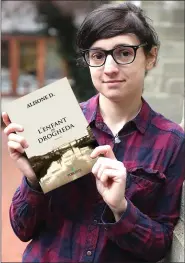  ??  ?? Author Cynthia Lourties with her book.