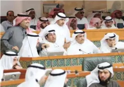  ??  ?? KUWAIT: MPs are seen during a raucous session of the National Assembly yesterday. — Photo by Yasser Al-Zayyat