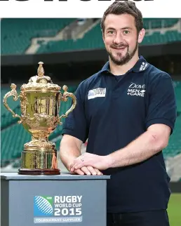  ??  ?? On a high again: Laidlaw gets close to the Webb Ellis Cup yesterday