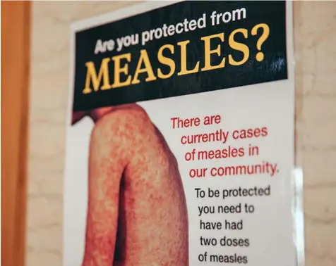  ?? Photo: RNZ ?? A New Zealand awareness poster on measles .