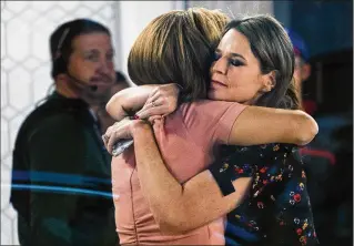  ?? CRAIG RUTTLE / ASSOCIATED PRESS ?? Co-anchors Hoda Kotb (left) and Savannah Guthrie embrace on the set of the “Today” show on Wednesday in New York after NBC News announced that it had fired host Matt Lauer. The two broke the news to viewers at the top of Wednesday morning’s show.