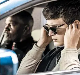  ?? WILSON WEBB/TRISTAR PICTURES ?? Jamie Foxx, left, plays a bank robber and Ansel Elgort plays Baby, the getaway driver.