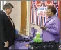  ?? (Arkansas Democrat-Gazette/ Dale Ellis) ?? Bill Wussick, assistant director for Veterans Cemeteries for the Arkansas Department of Veterans Affairs, visits with Joyce Murry, an Arkansas National Guard family assistance specialist, at the grand opening of the Pine Bluff Veterans Legal Clinic.