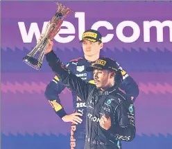  ?? AP ?? Merc’s Lewis Hamilton celebrates as Red Bull's Max Verstappen looks on at the Saudi Arabian GP.
