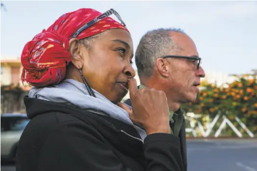  ?? Brontë Wittpenn / The Chronicle ?? Director Dawn L. Troupe and local playwright John Wilkins watch rehearsals of Oakland Theater Project’s “The Dream Life of Malcolm X,” in the parking lot of Flax Art & Design in Oakland.