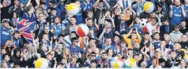  ?? ?? Party atmosphere Rangers fans with beach balls at a Dundee United match