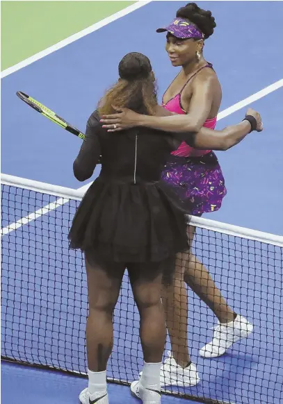  ?? AP PHOTO ?? SIBLING LOVE: Serena Williams (left) gives a hug to her sister Venus after Serena’s straight-set victory in the third round of the U.S. Open last night in New York.