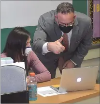  ?? PETE BANNAN - MEDIANEWS GROUP ?? U.S. Secretary of Education Miguel Cardona gives the thumbs up to virtual students in Danielle Shalon’s seventhgra­de math class at Beverly Hills Middle School.