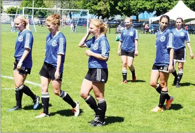  ?? DAVID CROMPTON/Penticton Herald ?? Members of the Penticton Pinnacles women’s team walk off the field after beating the Hat-Tricks 2-0 in the A final of the May Classic soccer tournament Monday at King’s Park.