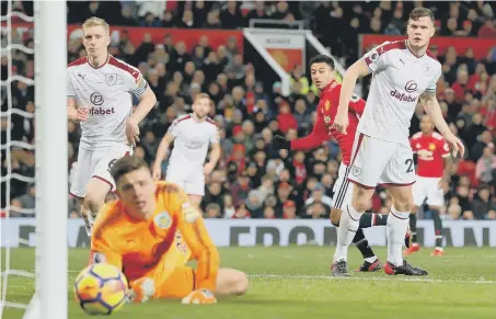  ??  ?? Jesse Lingard (red) fires home Manchester United’s first goal in their comeback from 2-0 down to draw 2-2 at home to Burnley yesterday.