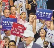  ?? REUTERS ?? People cheer as Republican presidenti­al nominee Donald Trump speaks in Dimondale, Michigan, on Friday.