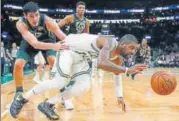  ?? AP ?? Celtics' Kyrie Irving (11) drives past Milwaukee' Ersan Ilyasova.